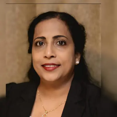 Portrait of Mercy George, a candidate, smiling and dressed in professional attire.